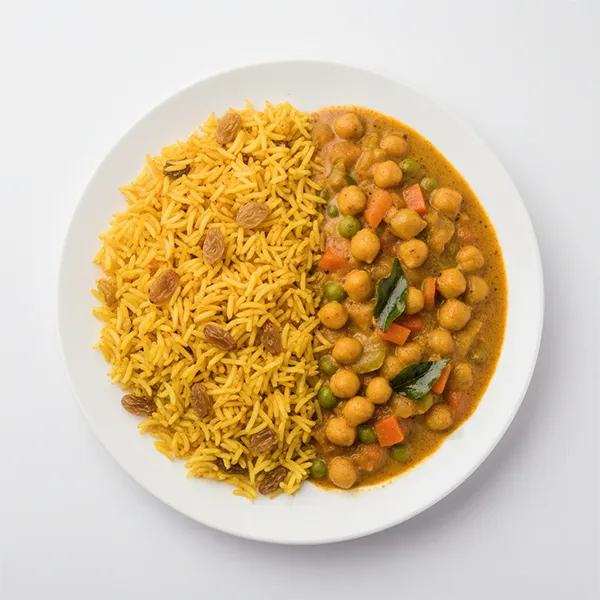 Sindhi Chole vegetable kadhi with turmeric and raisin rice